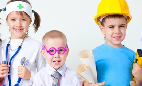 Group of six children dressing up as professions
