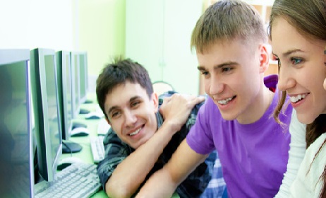 group of young students studying in the classroom with computer