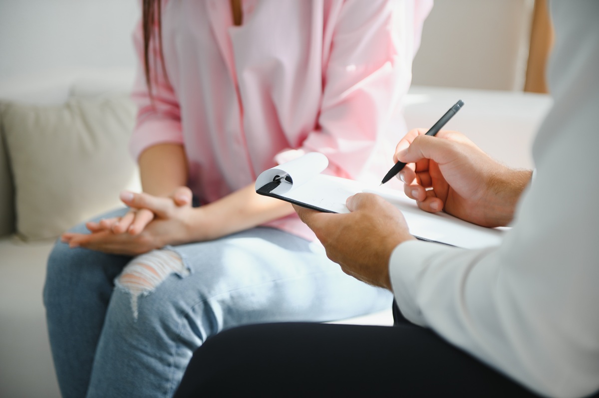 woman with mental health problems is consulting. psychiatrist is recording the patient’s condition for treatment. encouragement, love and family problem, bipolar , depression patient, protect suicide.
